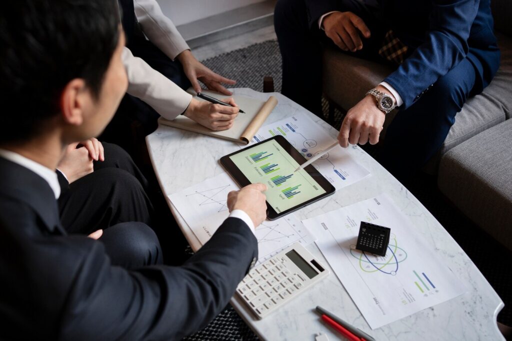 Business people working with ipad high angle